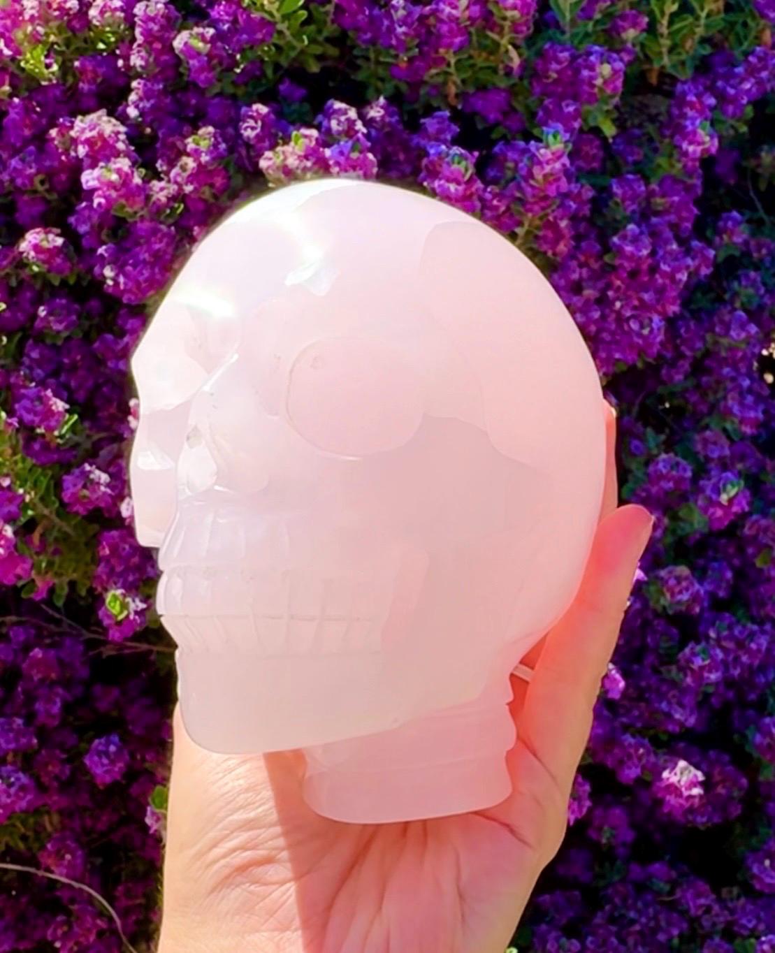 Bright UV Reactive Mangano Calcite Skull With Spine