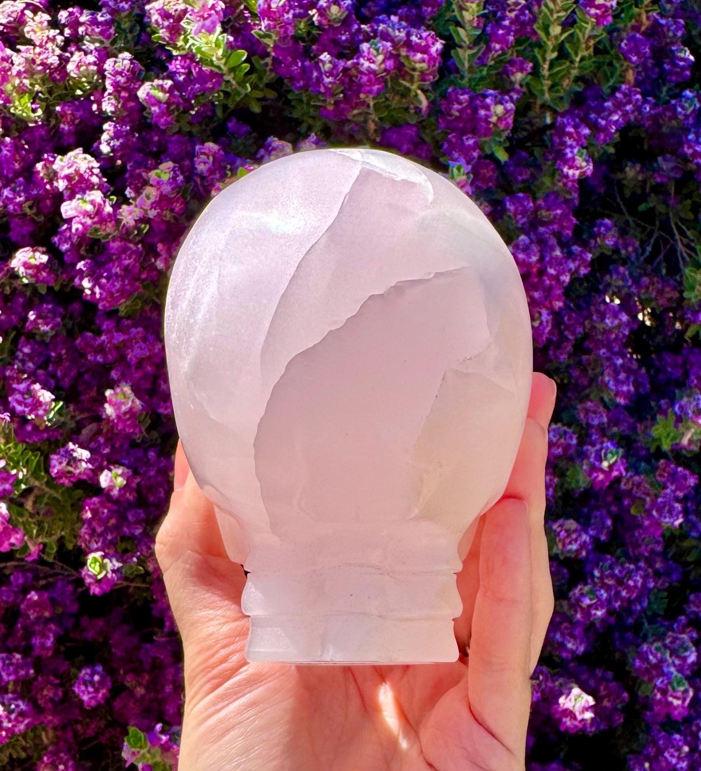 Bright UV Reactive Mangano Calcite Skull With Spine