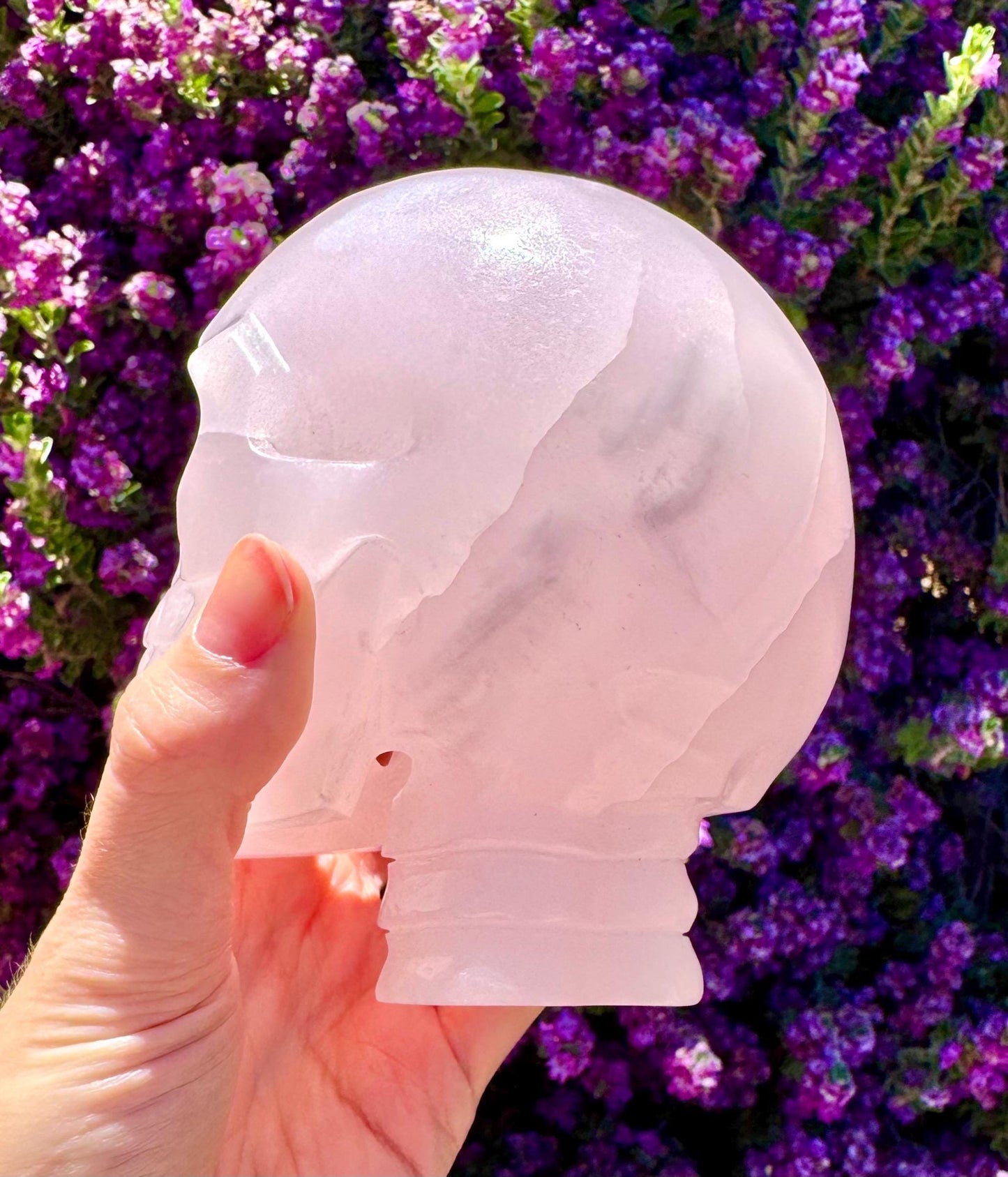 Bright UV Reactive Mangano Calcite Skull With Spine