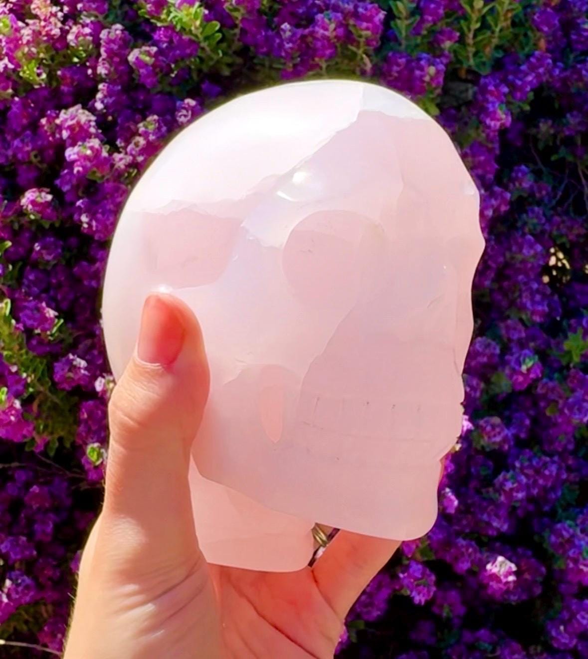 Bright UV Reactive Mangano Calcite Skull With Spine